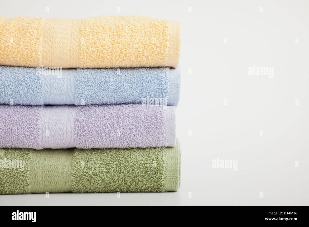 Studio shot of stack of pastel colored towels Stock Photo