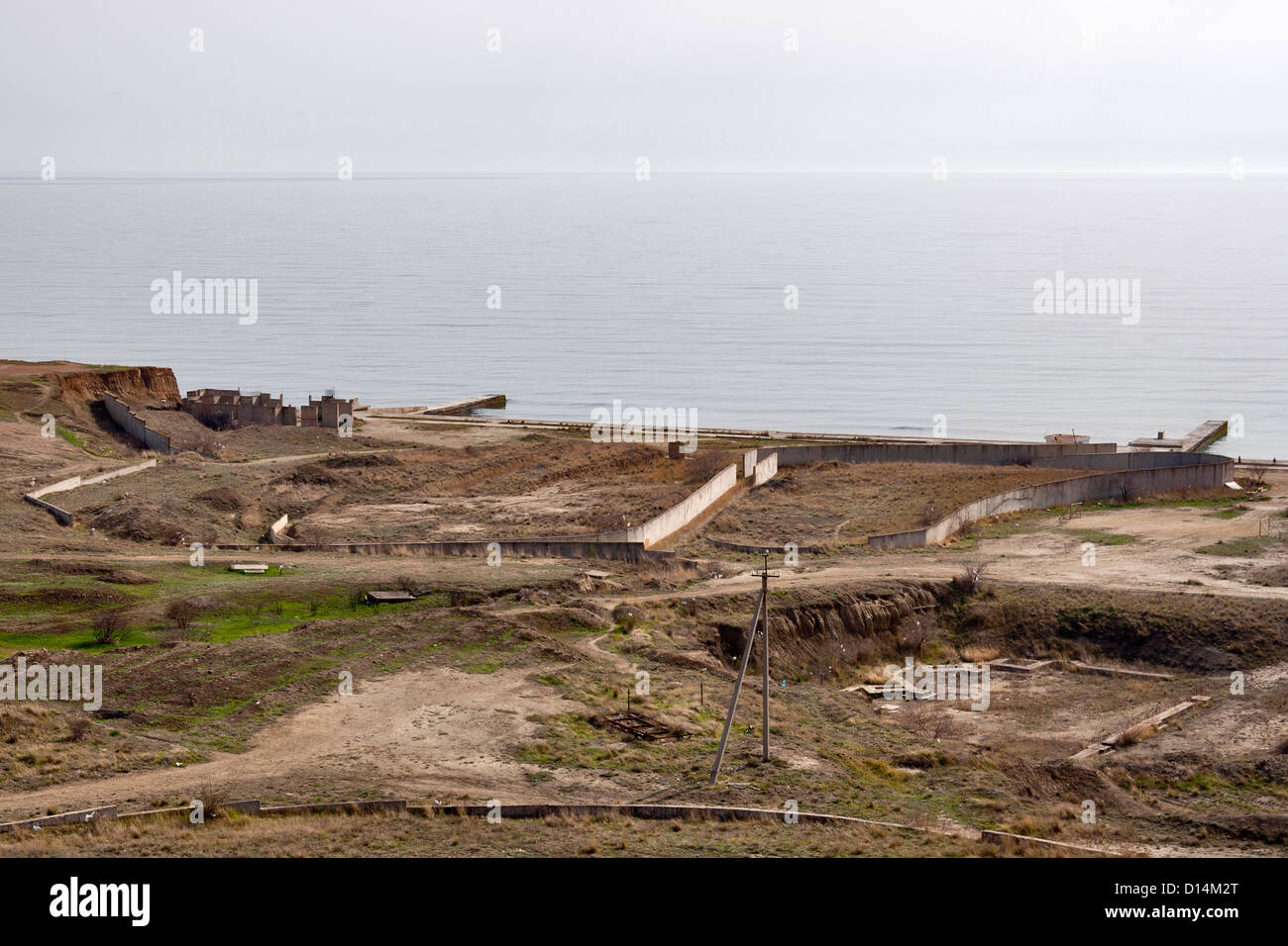 Remains of Soviet unfinished abandoned military navy base. Crimea, Ukraine. Stock Photo