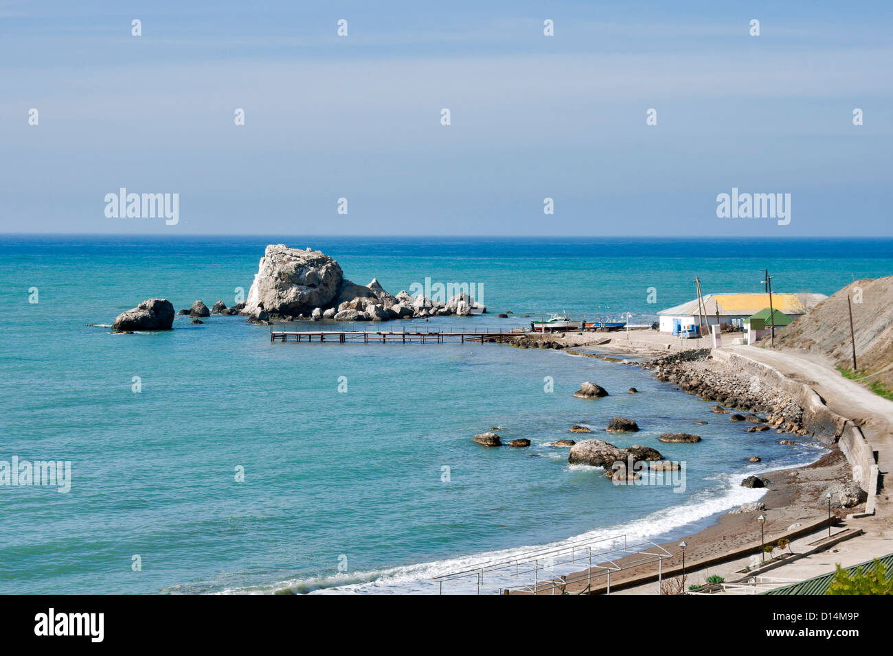 Sudak pebble beach at sunny day. Crimea, Ukraine. Stock Photo