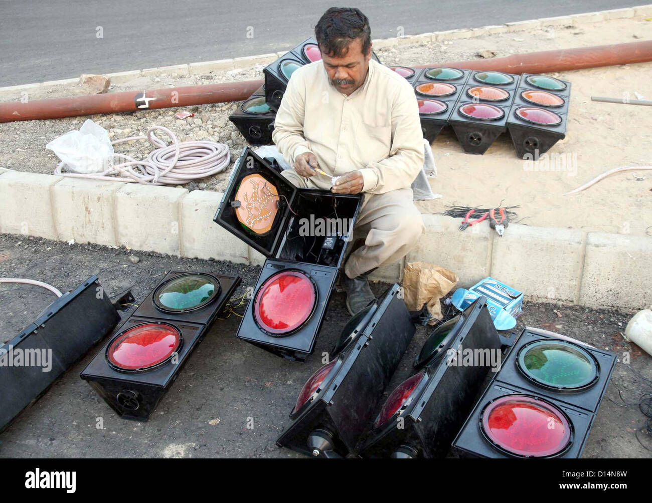 Traffic Police Technician busy in installation of new Traffic Signals