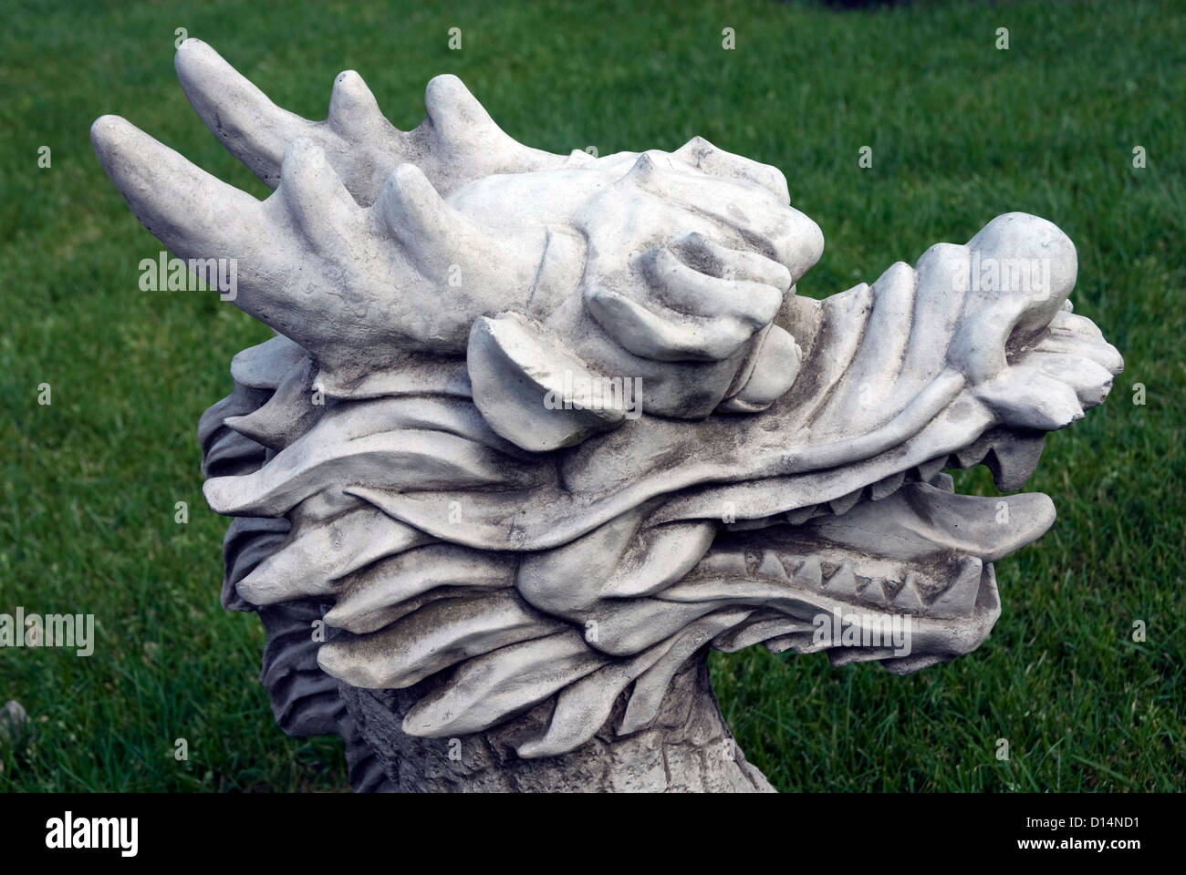 Statue of a dragons head in a garden in Bath Somerset England UK Stock Photo