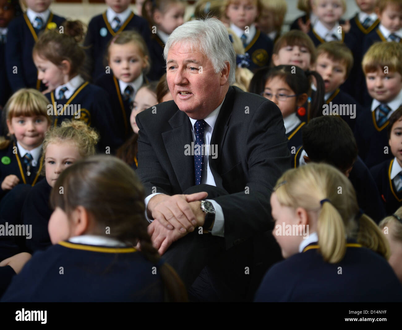 Headmaster James Devine talking to children in morning assembly at Our Lady & St. Werburgh's Catholic Primary School in Newcastl Stock Photo