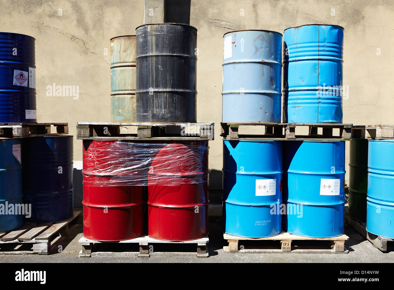 Drums of liquid on wooden pallets Stock Photo Alamy