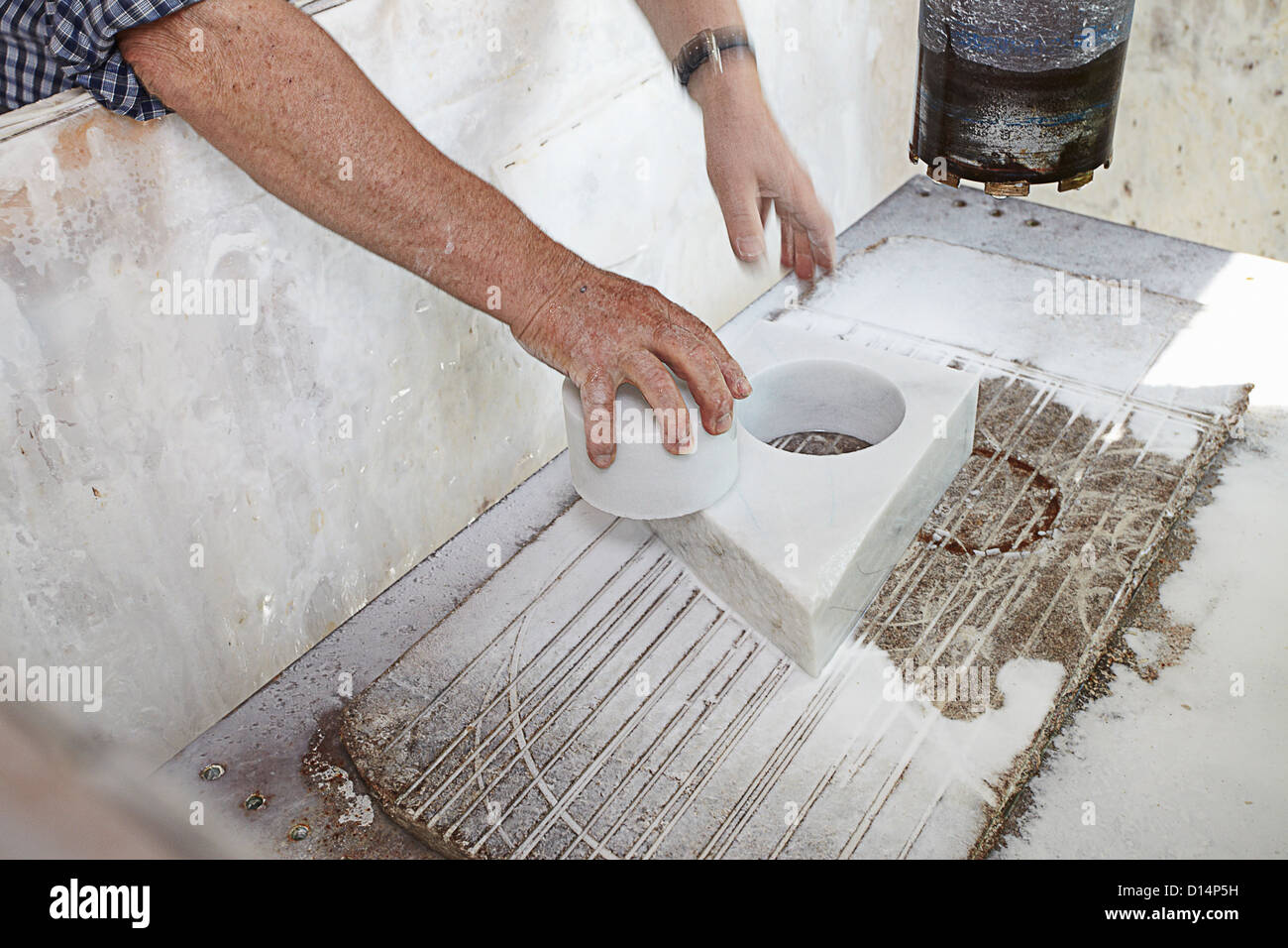 Worker pulling cut stone from block Stock Photo Alamy