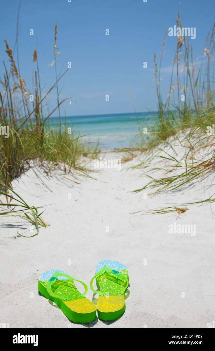 USA, Florida, St. Petersburg, Pair of flip flops on sandy beach Stock Photo