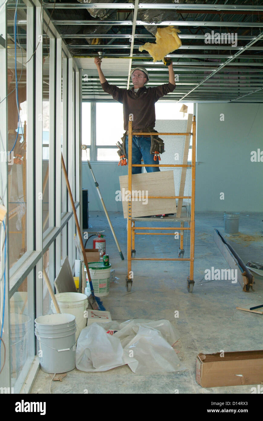 Construction Worker Installing Ceiling Stock Photo