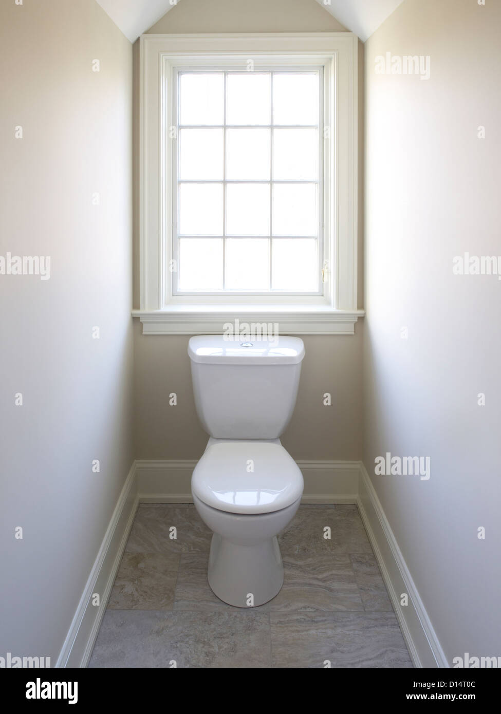 Toilet & Window In Very Small Room Stock Photo