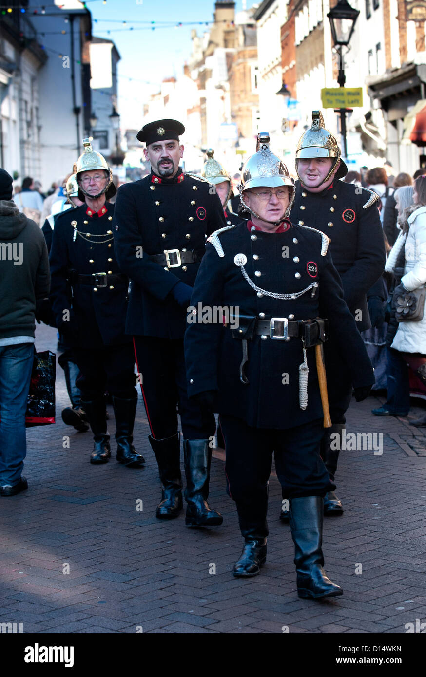 Members of the Fire Preservation Group parading during the Dickens Christmas Festival. Stock Photo