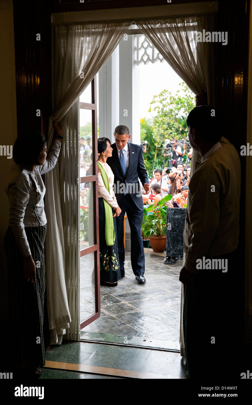 US President Barack Obama walks with Burmese Opposition Leader Aung San Suu Kyi following their statements to the press at her home November 19, 2012 in Rangoon, Burma. Stock Photo