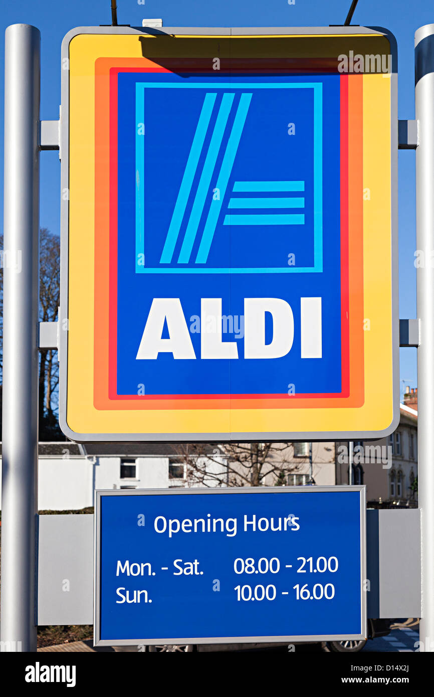 Aldi supermarket sign with opening hours, Abergavenny, Wales, UK Stock