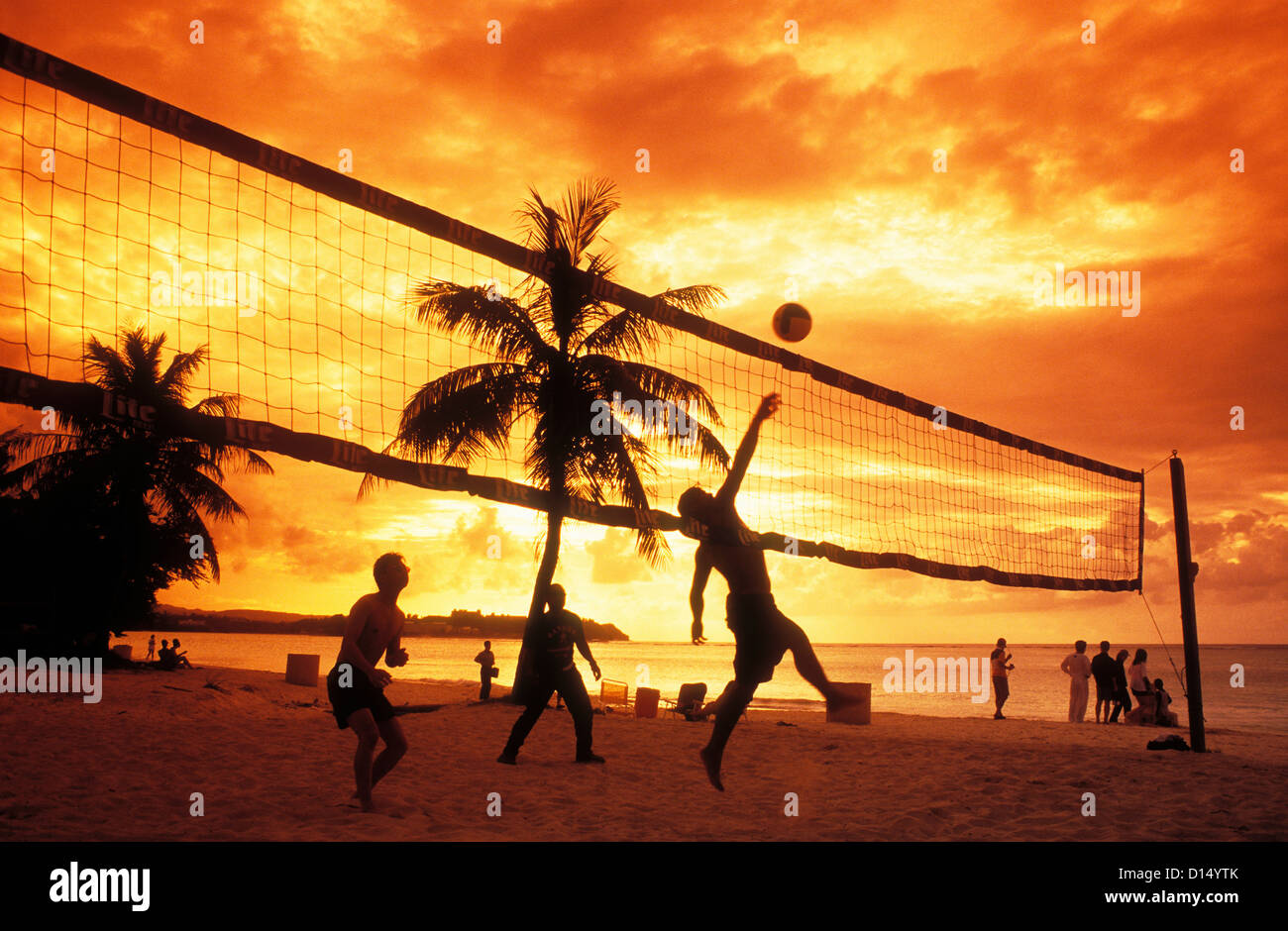 Micronesia, Guam, Tumon Bay, People Playing Volleyball On Beach At