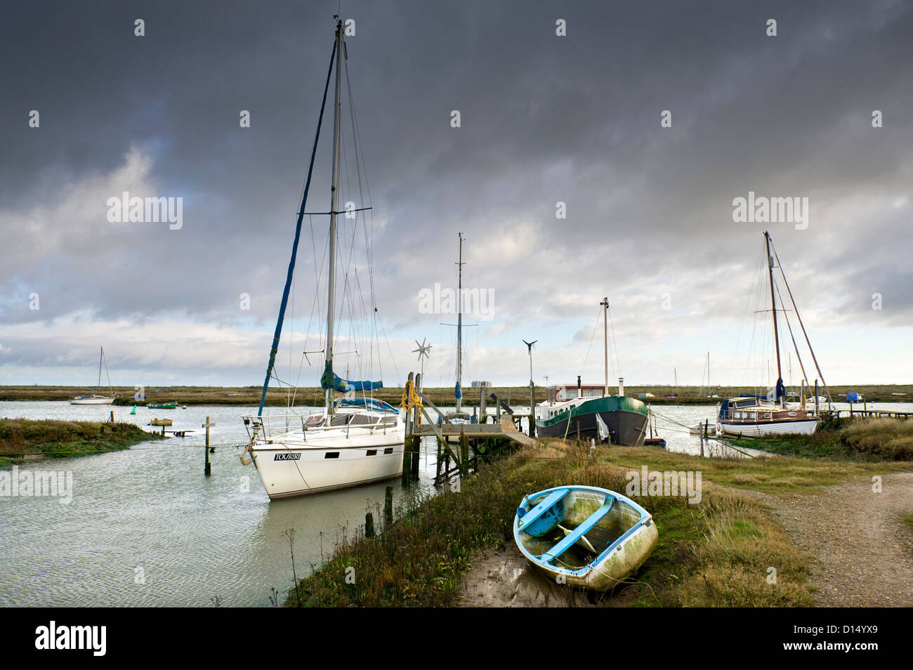 Boats moored on Tollesbury Saltings. Stock Photo