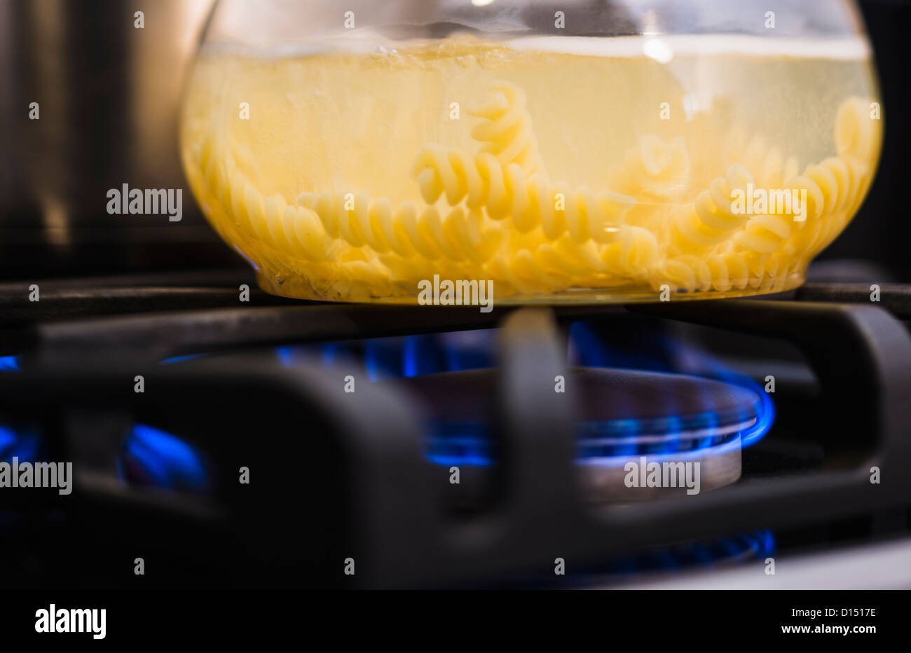 Close-up of pasta boiling on gas burner Stock Photo