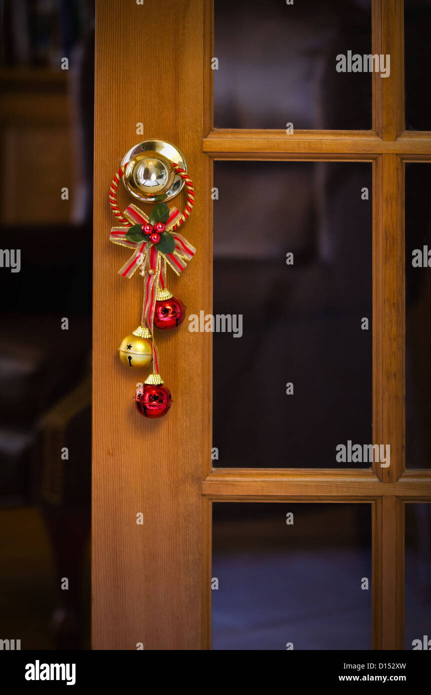 Christmas bells hanging on the door knob Stock Photo