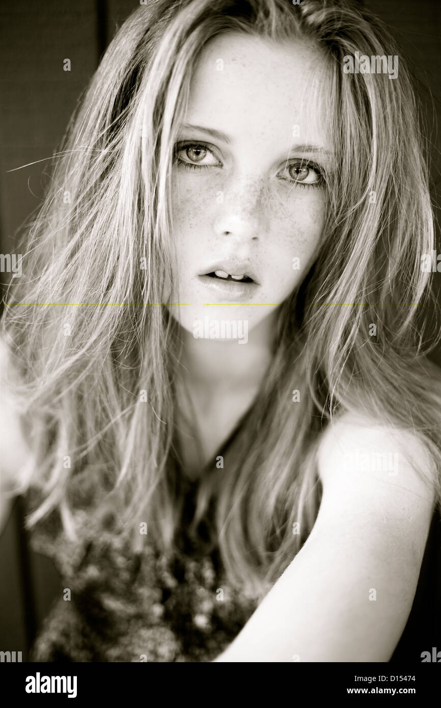 Young Woman With Red Hair And Freckles Poses For Camera Stock Photo - Alamy