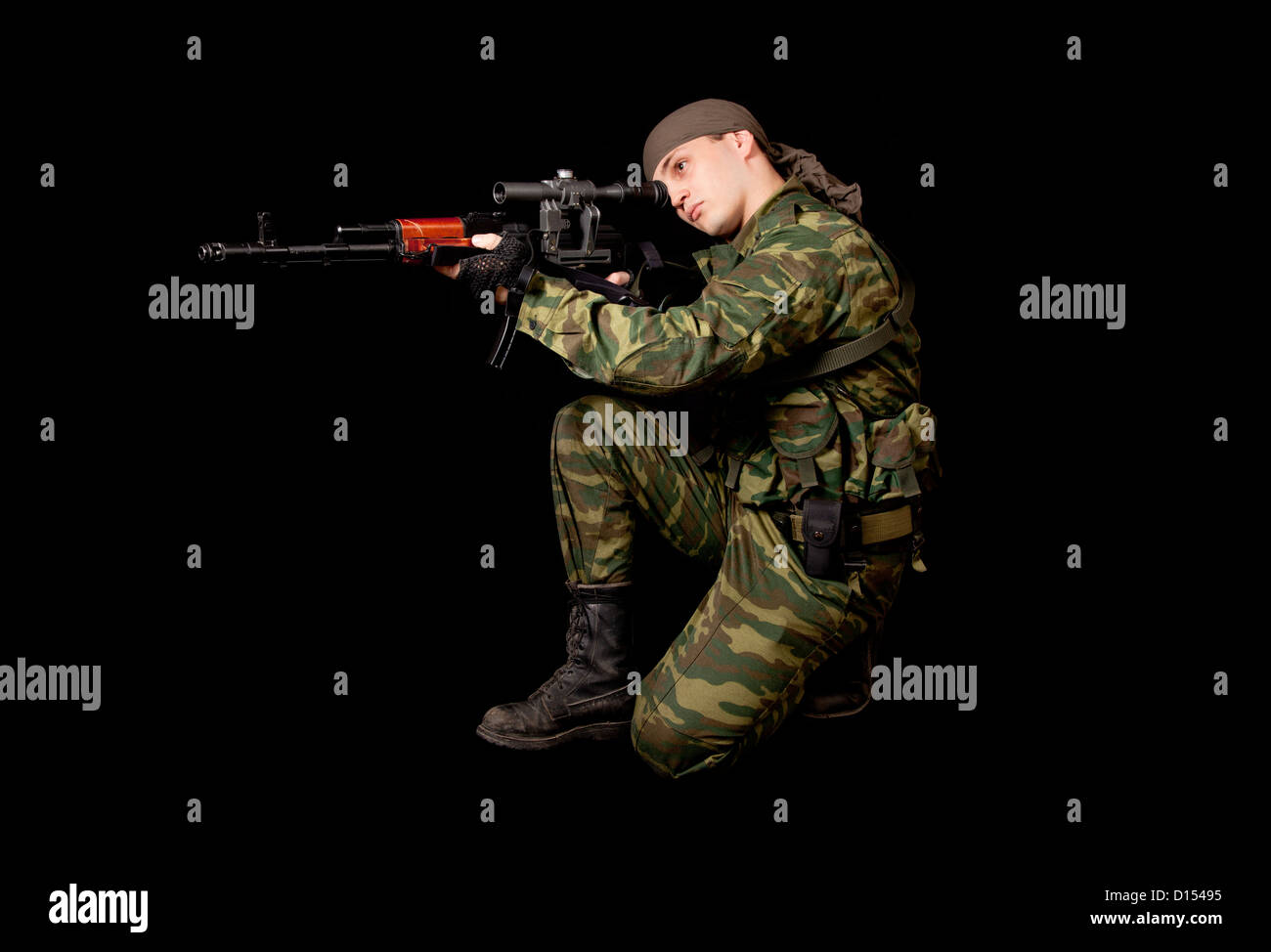 Soldier in uniform with rifle, isolated on black background Stock Photo ...