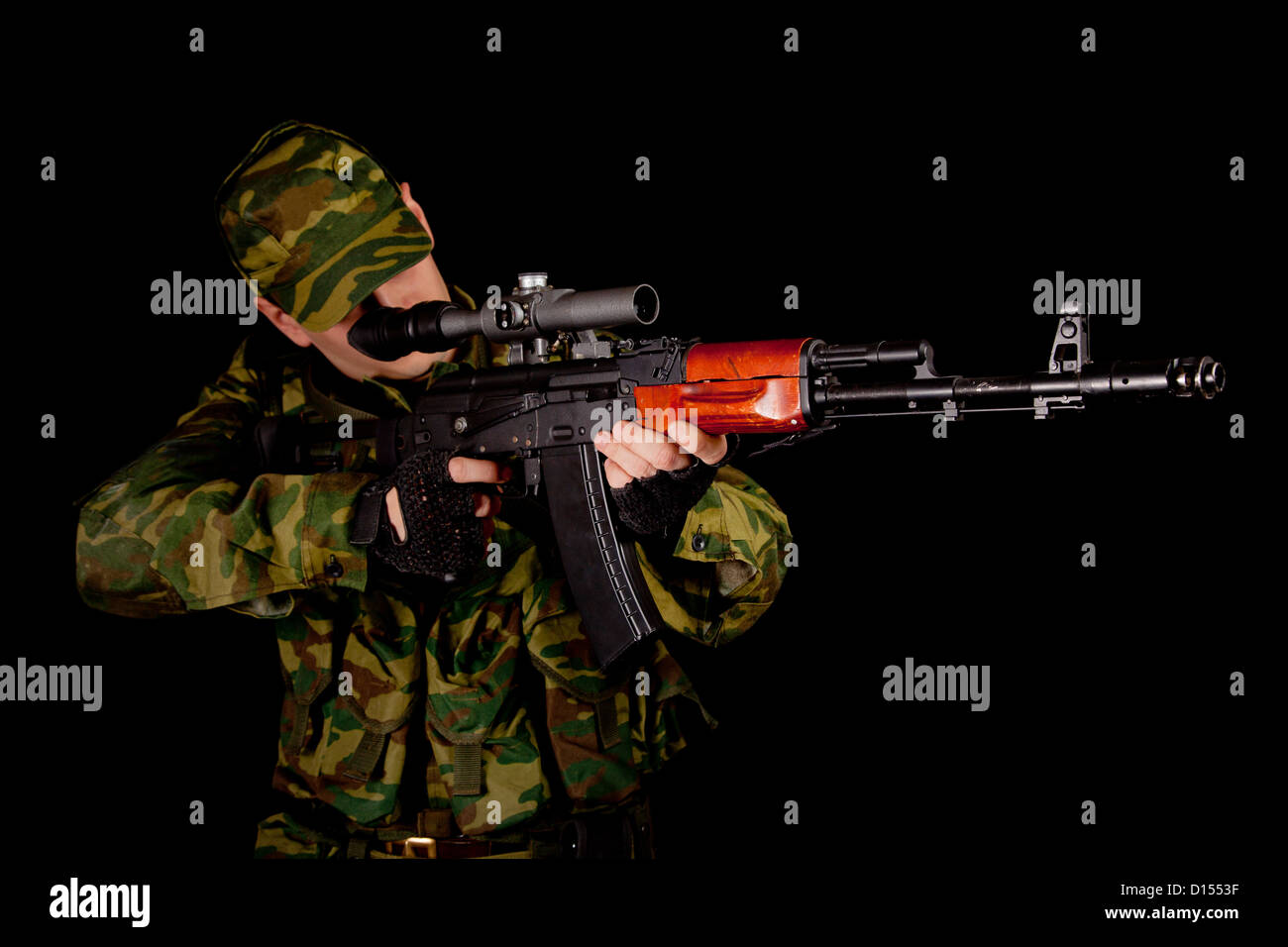 Soldier in uniform with rifle, isolated on black background Stock Photo ...