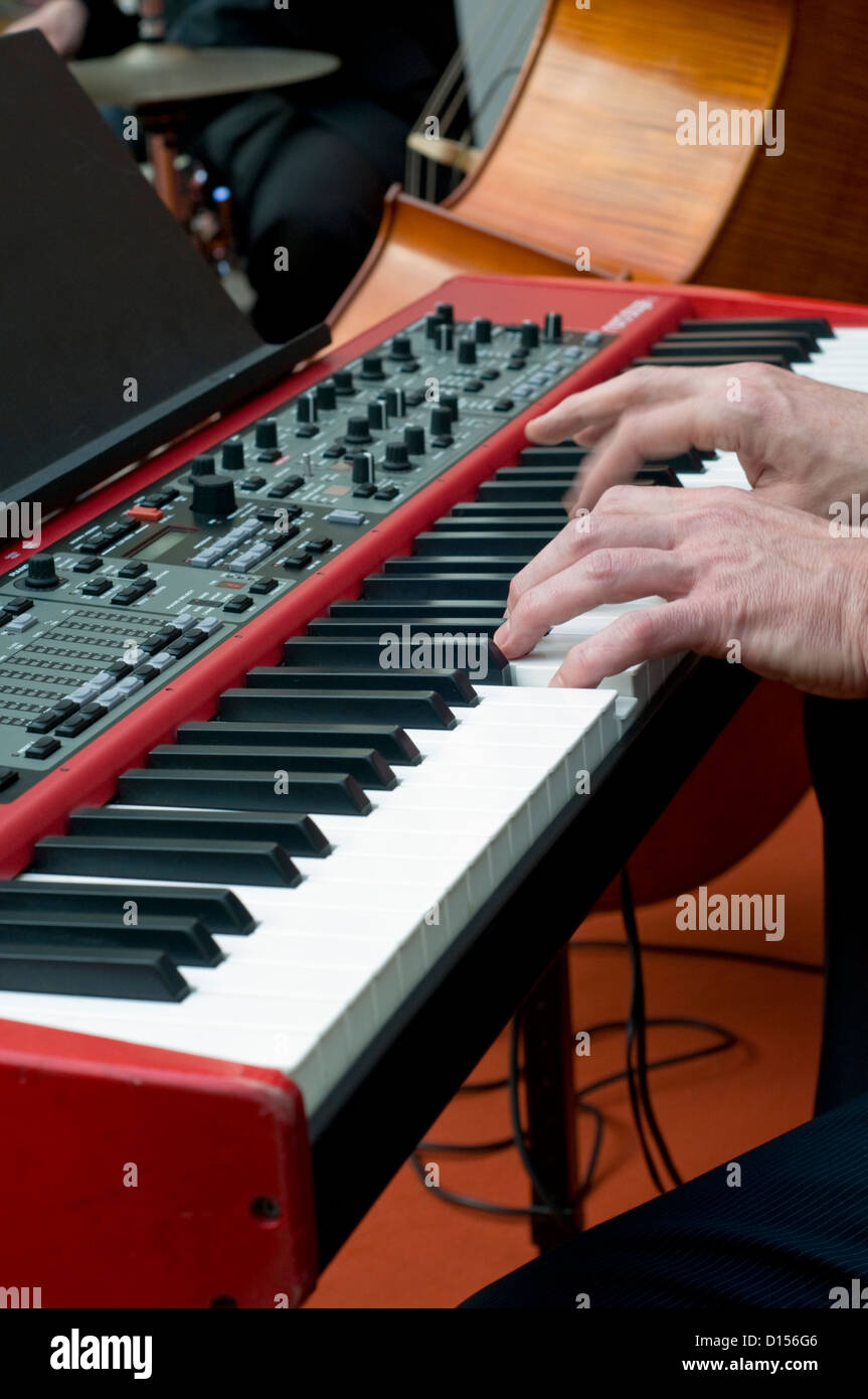 Close-up of a pianist playing a keyboard in a jazz band Stock Photo