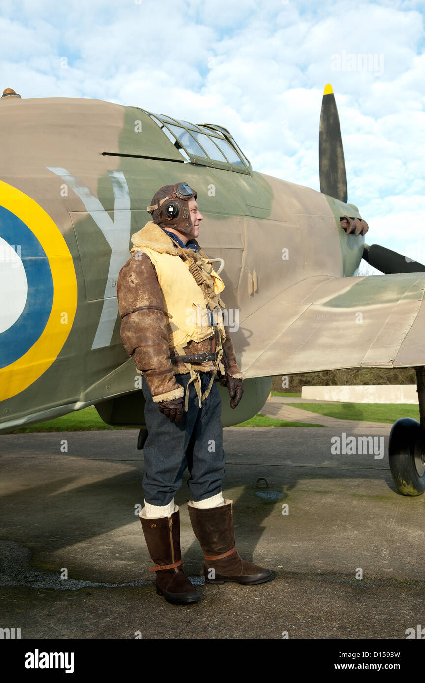 World War Two RAF pilot standing next to his Hurricane fighter aircraft. Stock Photo