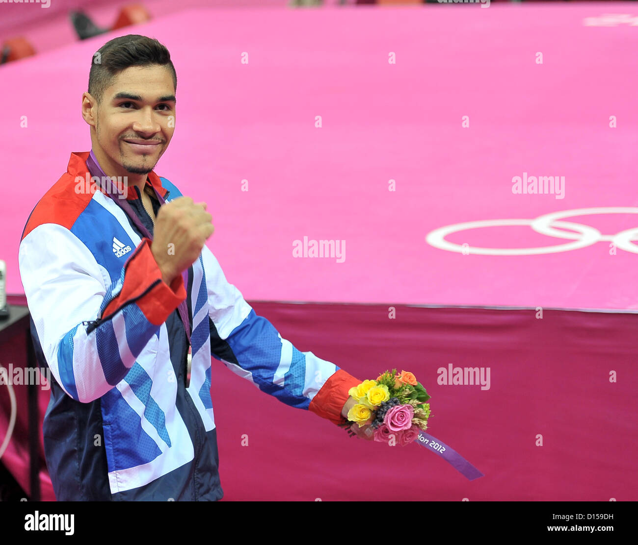 Louis Smith (GBR, Great Britain) punches the air after getting his silver medal. Individual Gymnastics Stock Photo