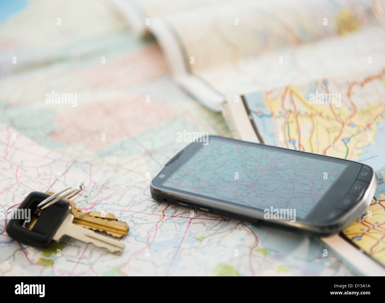 Map Key Phone Car keys and smartphone on map Stock Photo - Alamy