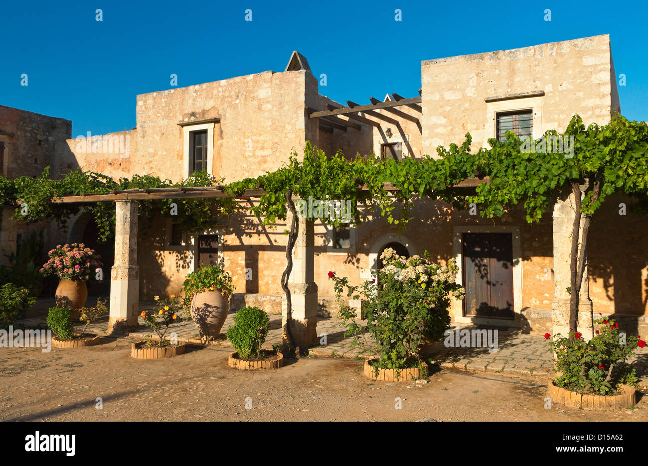 Traditional houses at Moni Arkadiou monastery of Crete island in Greece Stock Photo