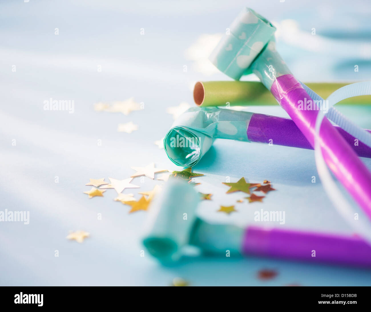 Studio shot of party blowers and confetti Stock Photo - Alamy