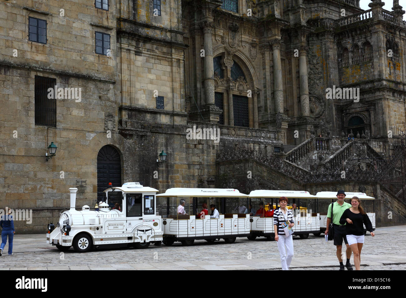 Tourist train in front of west facade of cathedral , Praza do Obradoiro , Santiago de Compostela , Galicia , Spain Stock Photo