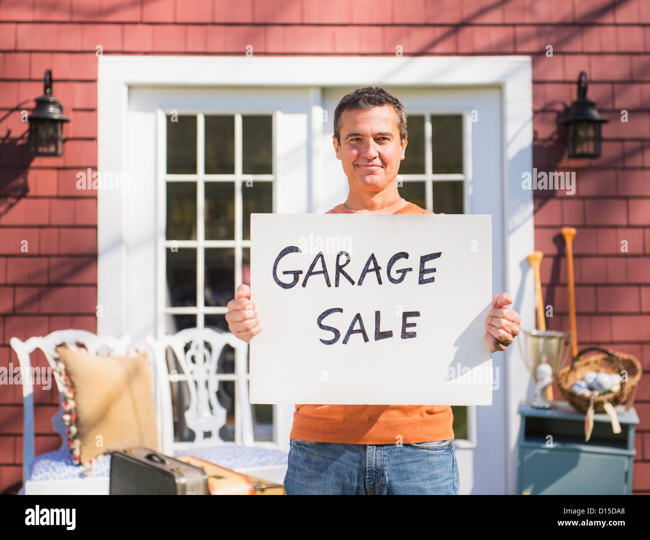 Usa New Jersey Mendham Portrait Of Man Holding Garage Sale Sign