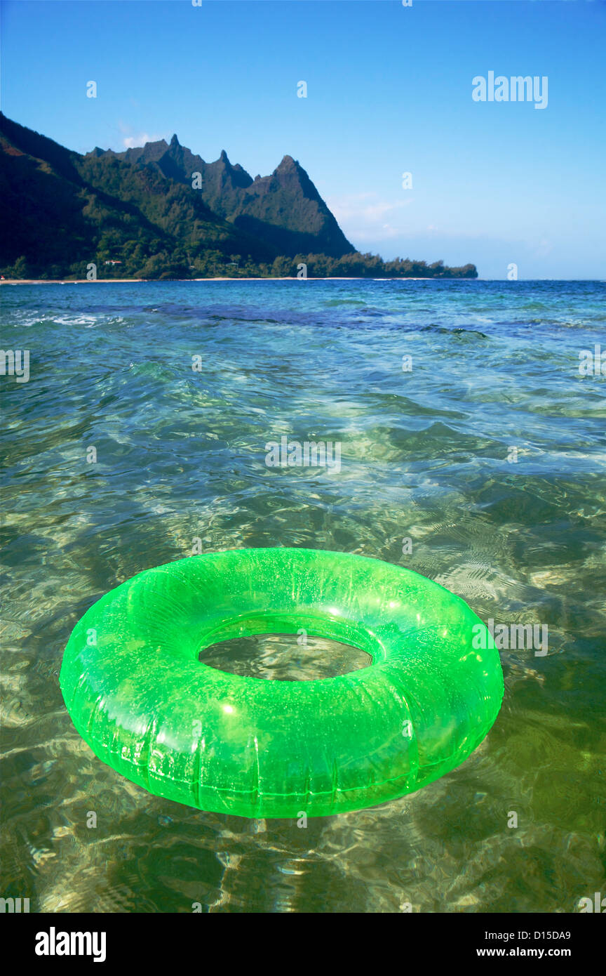 Hawaii, Kauai, Tunnels Beach, Green Innertube On The Water Stock Photo