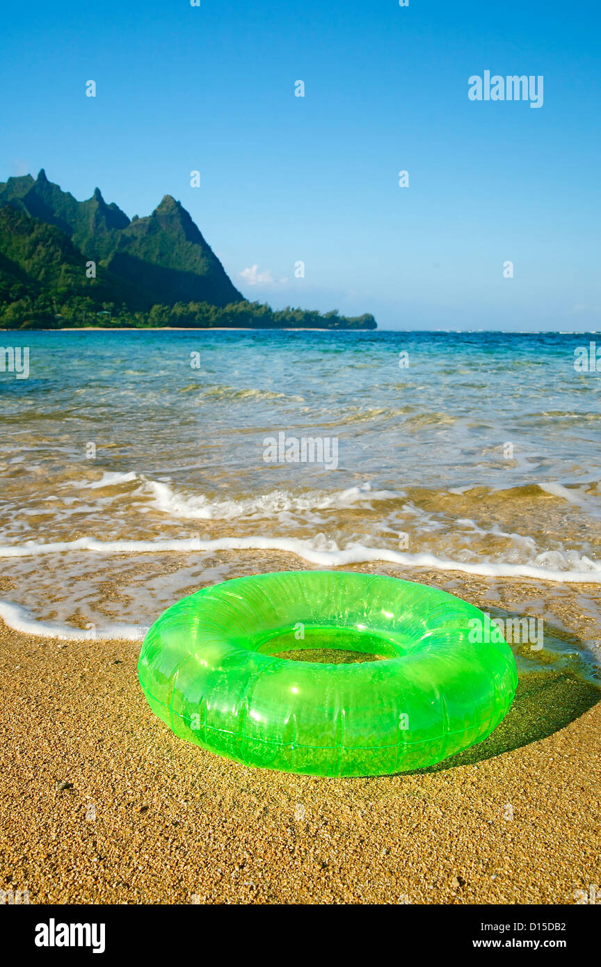 Hawaii, Kauai, Tunnels Beach, Green Innertube On The Beach Stock Photo