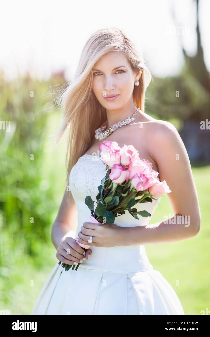 Portrait of bride holding bouquet Stock