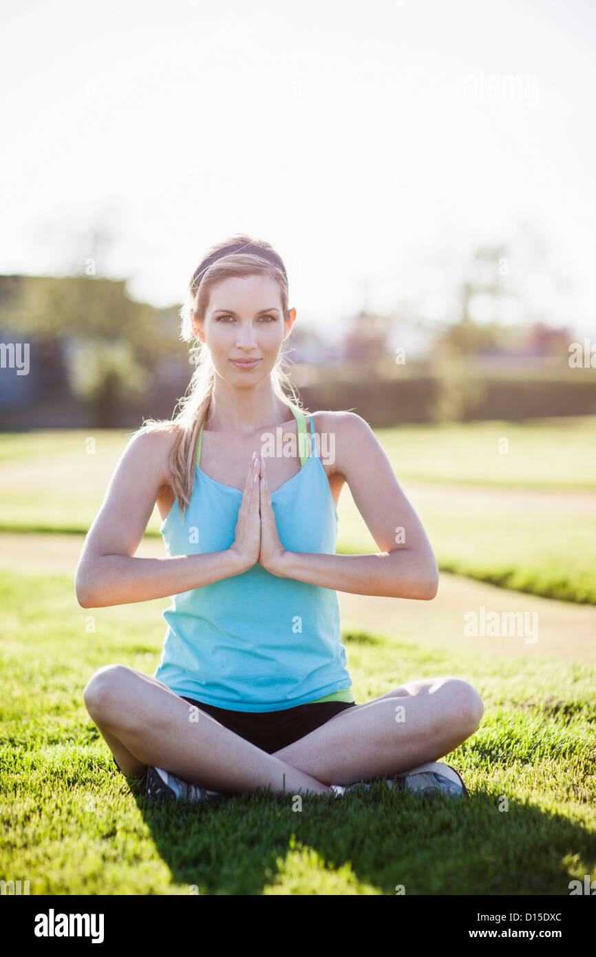 Woman Sitting Cross Legged And Doing Yoga Stock Photo Alamy   Woman Sitting Cross Legged And Doing Yoga D15DXC 