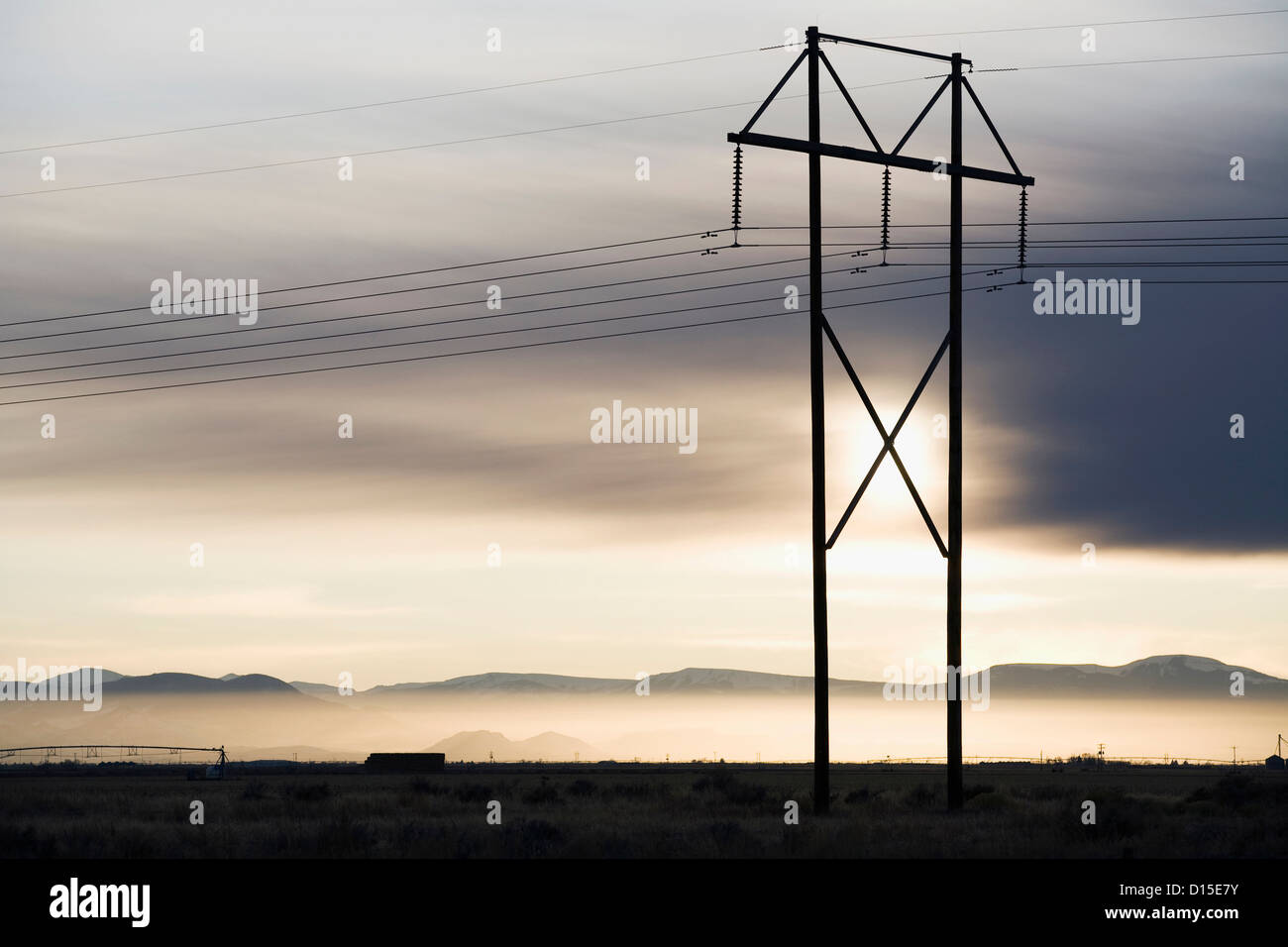 USA, Colorado, Power lines and tower at sunset Stock Photo
