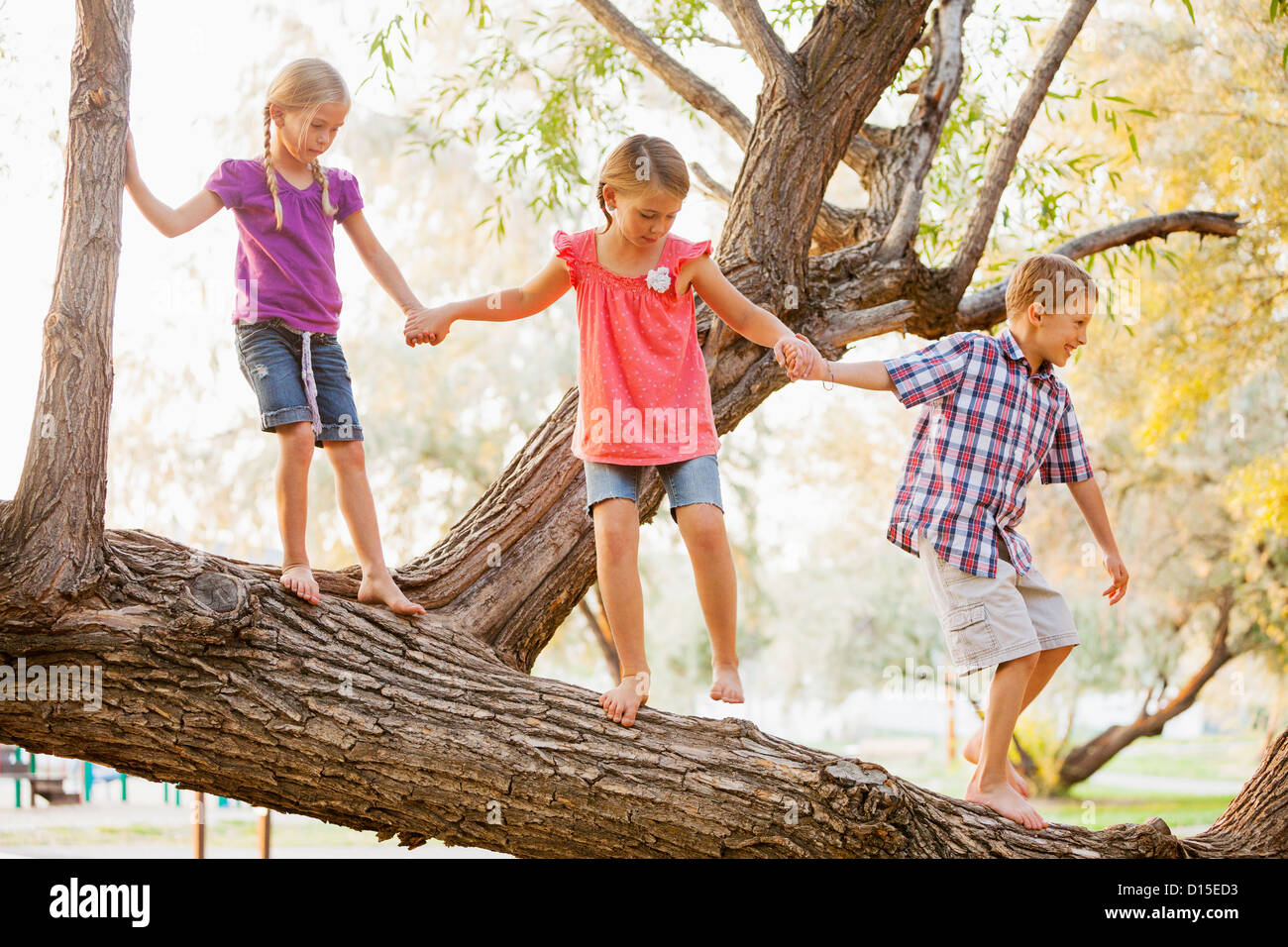 Kids holding hands row happy hi-res stock photography and images - Alamy