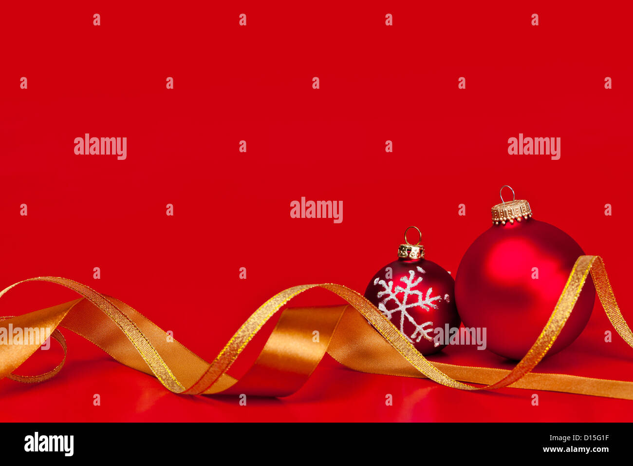 Red Christmas background with ornaments and gold ribbon Stock Photo - Alamy