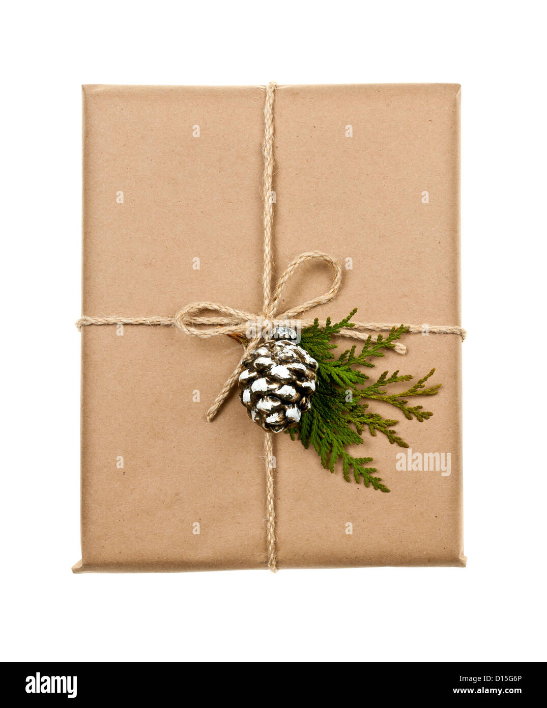Christmas gift in brown wrapping and string with pine cone decoration