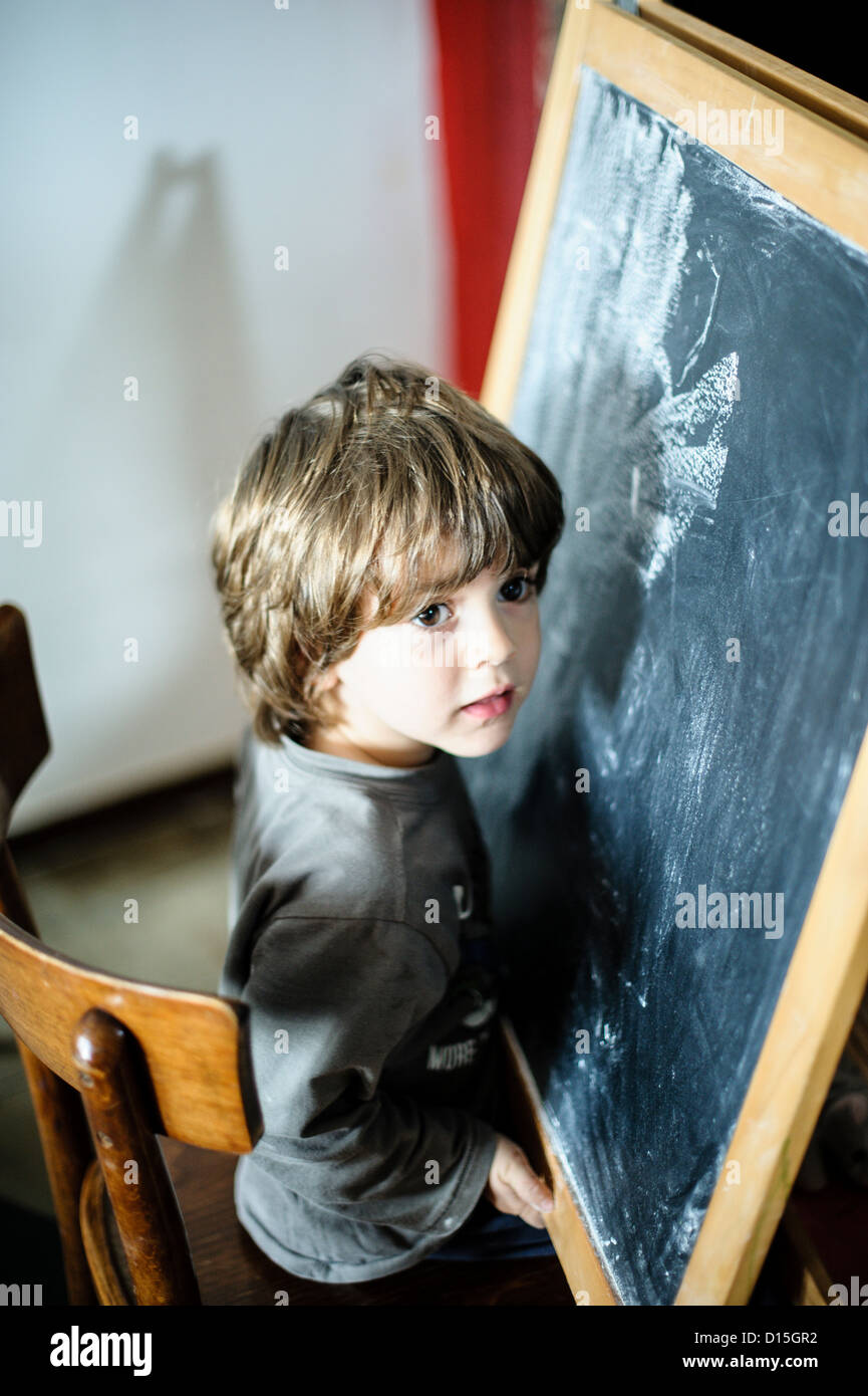 children draw on the blackboard Stock Photo Alamy
