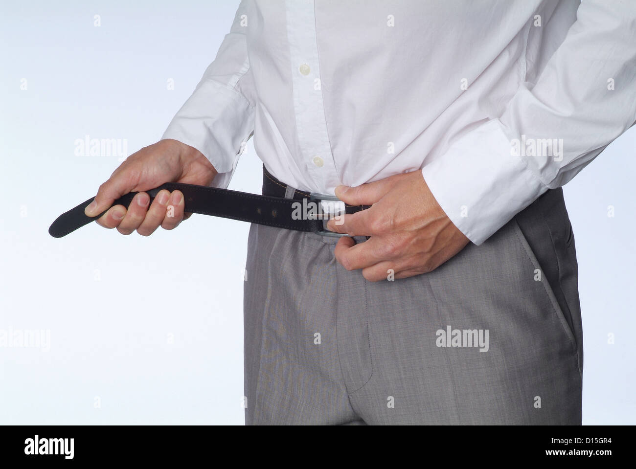 Hamburg, Germany, a man strapped on his belt tighter Stock Photo