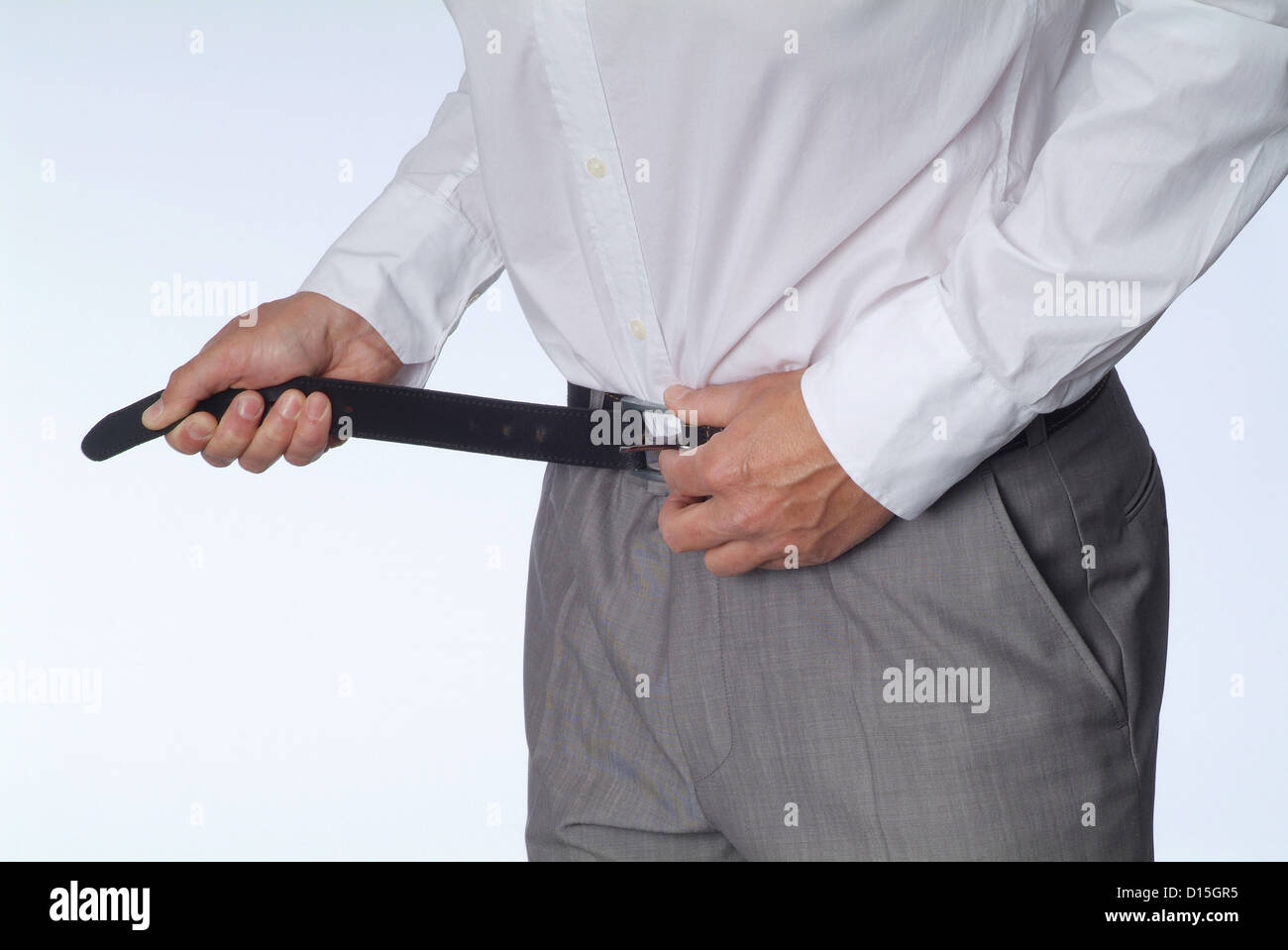 Hamburg, Germany, a man strapped on his belt tighter Stock Photo
