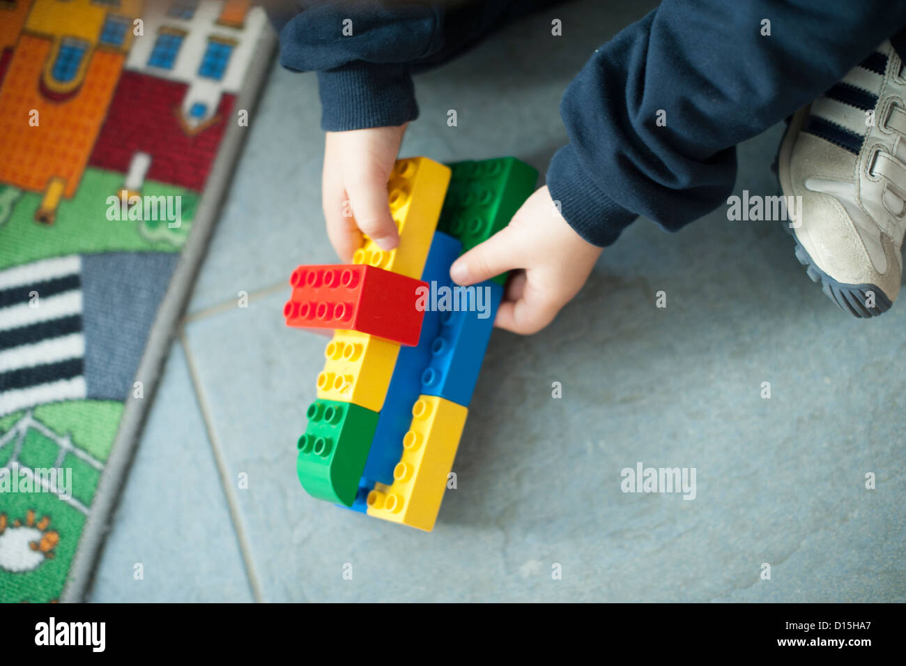 hands of a child playing with building blocks Stock Photo - Alamy