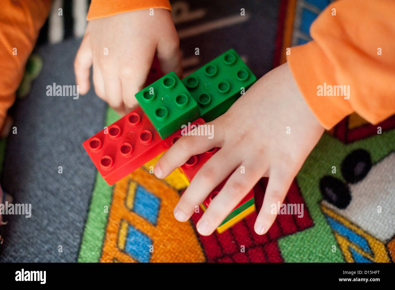 hands of a child playing with building blocks Stock Photo - Alamy