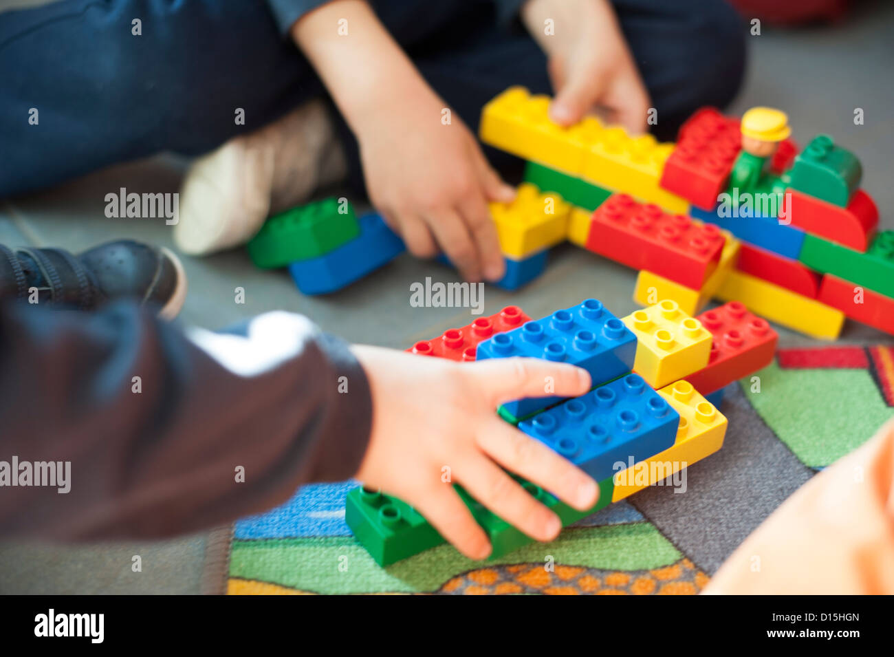hands of a child playing with building blocks Stock Photo - Alamy