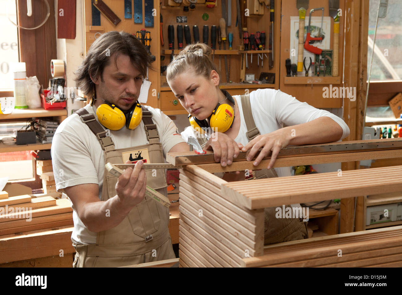 Duesseldorf, Germany, journeyman and apprentice in a carpenter's