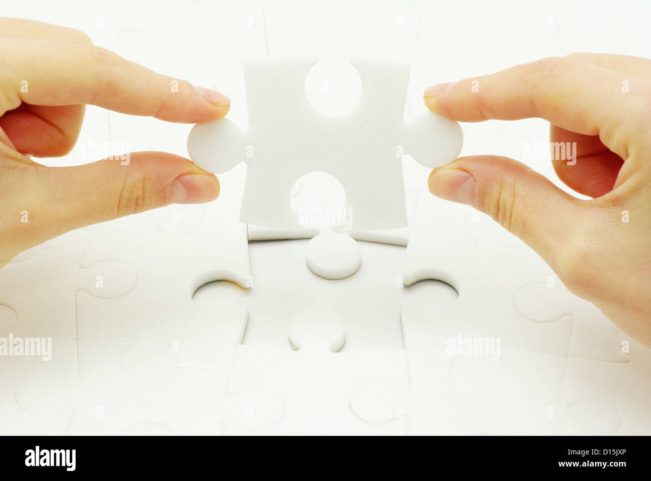 hands holding a puzzle piece . business concepts Stock Photo - Alamy