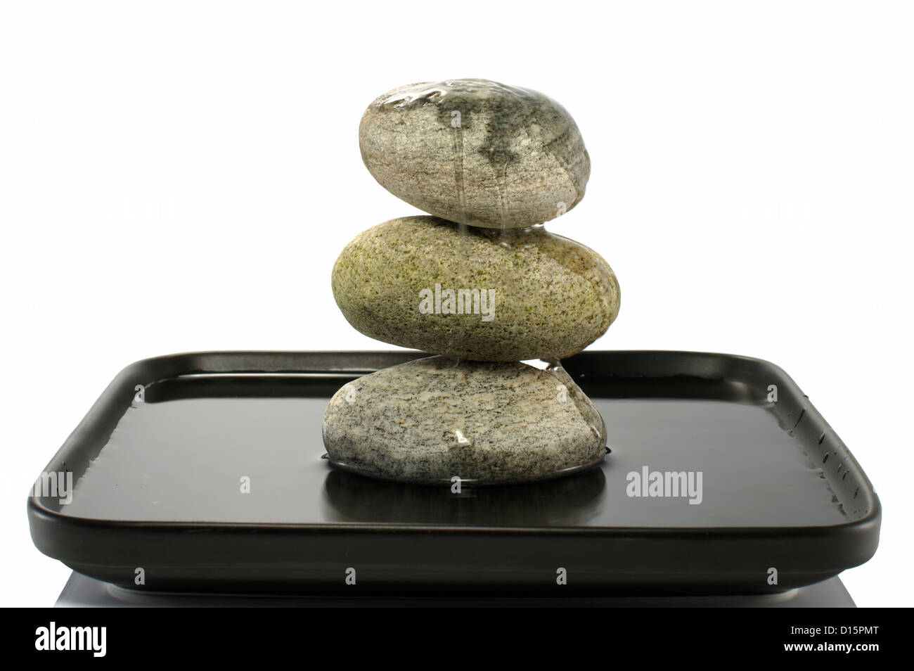 three stones in balance with water Stock Photo