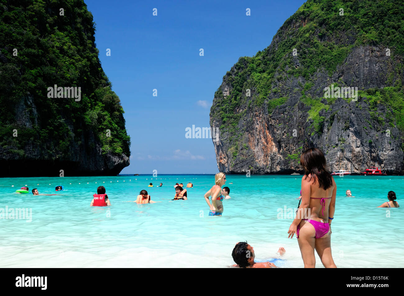 tropical paradise lagoon Maya Bay Ko Phi Phi Leh Ko Phi Phi Islands Krabi Thailand white sands beach people swimming swim Stock Photo