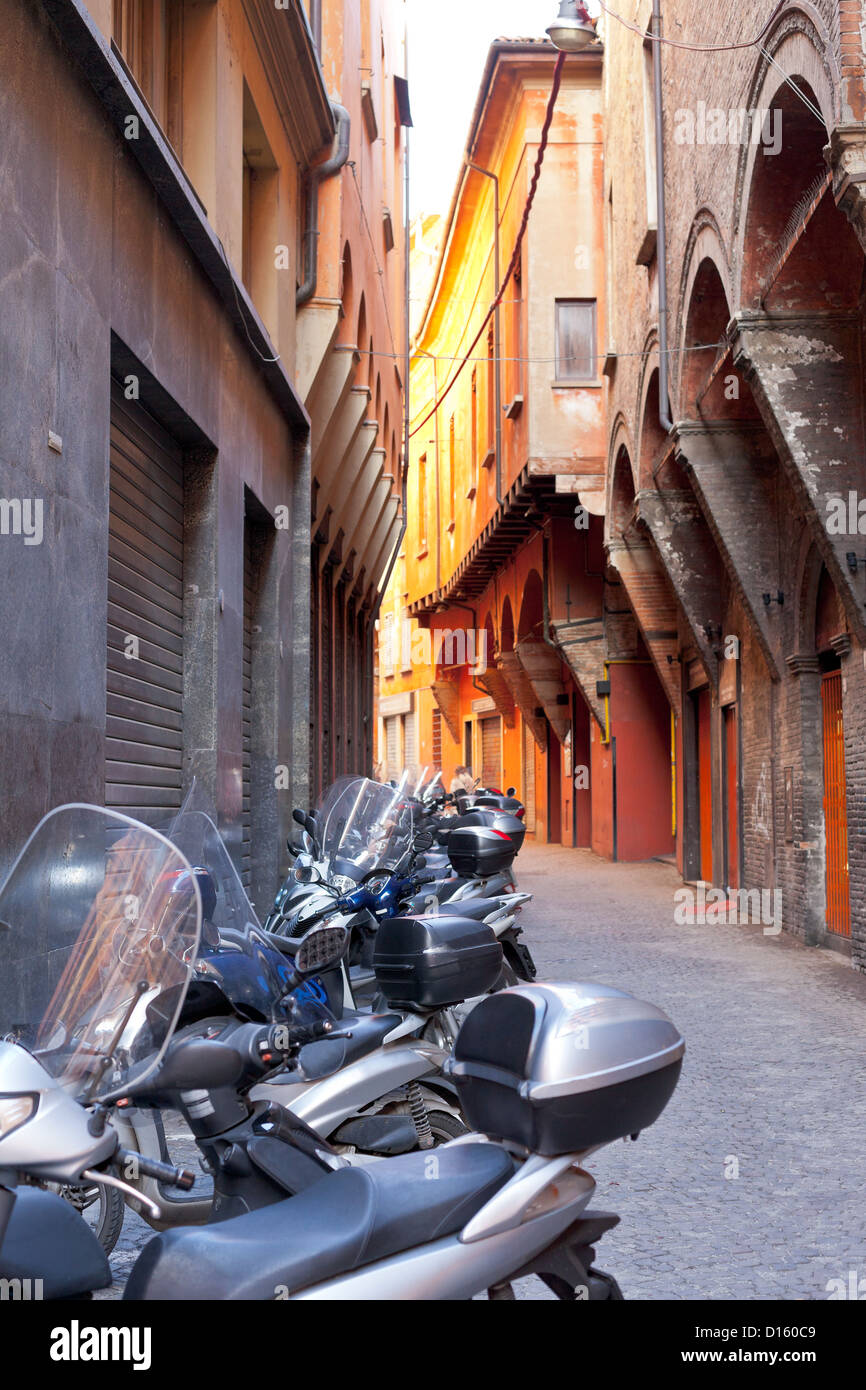 motorbike parking on Bologna old narrow street in morning, Italy Stock Photo Alamy