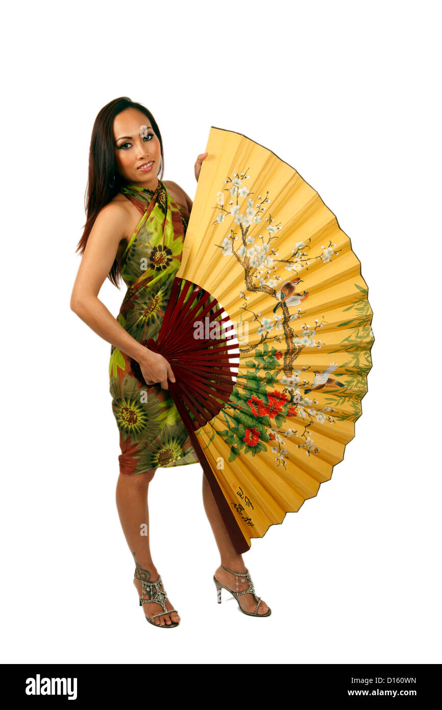 Young beautiful Asian woman holding a silk fan Stock Photo