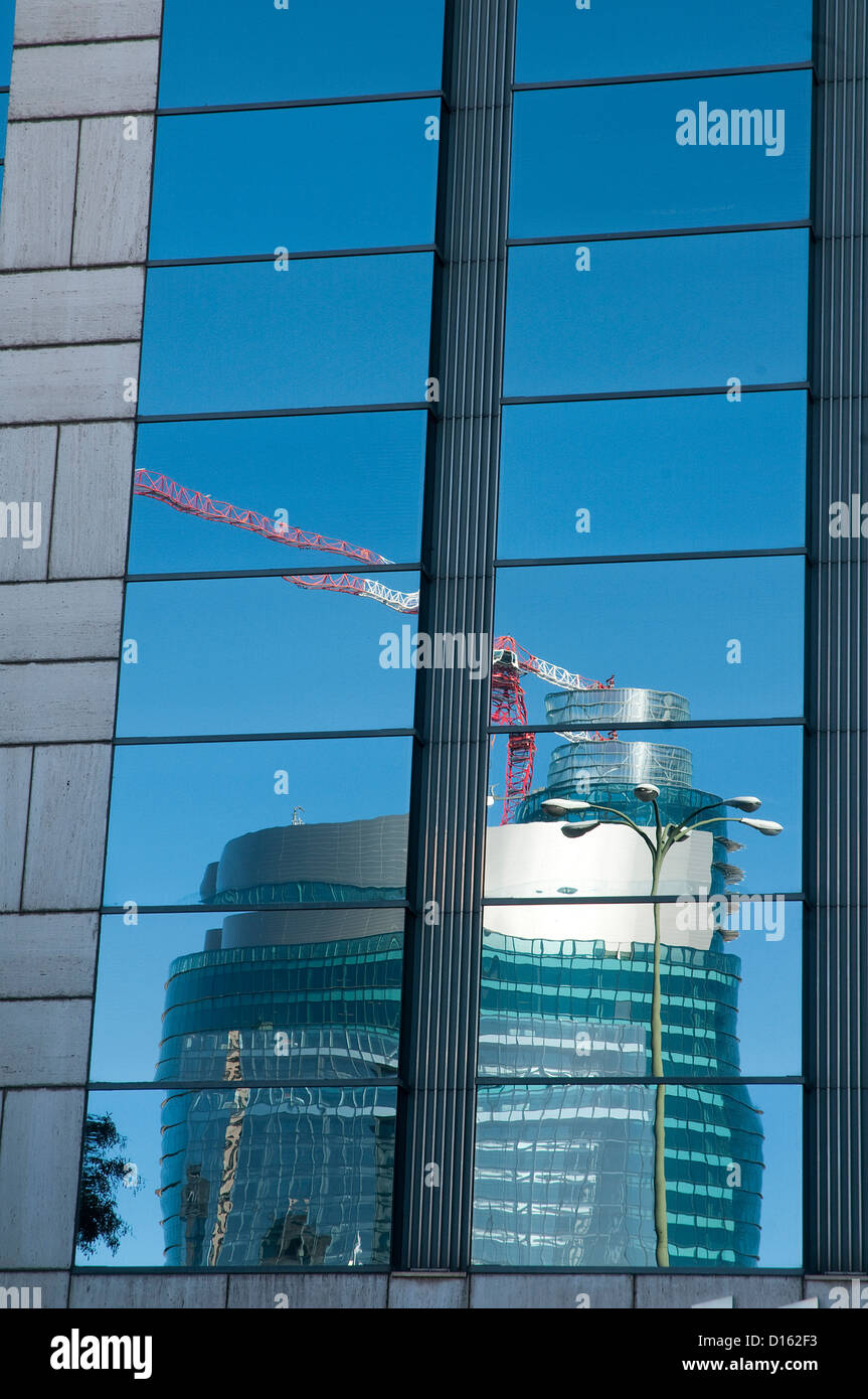 Titania tower reflected on glass facade. AZCA, Madrid, Spain. Stock Photo